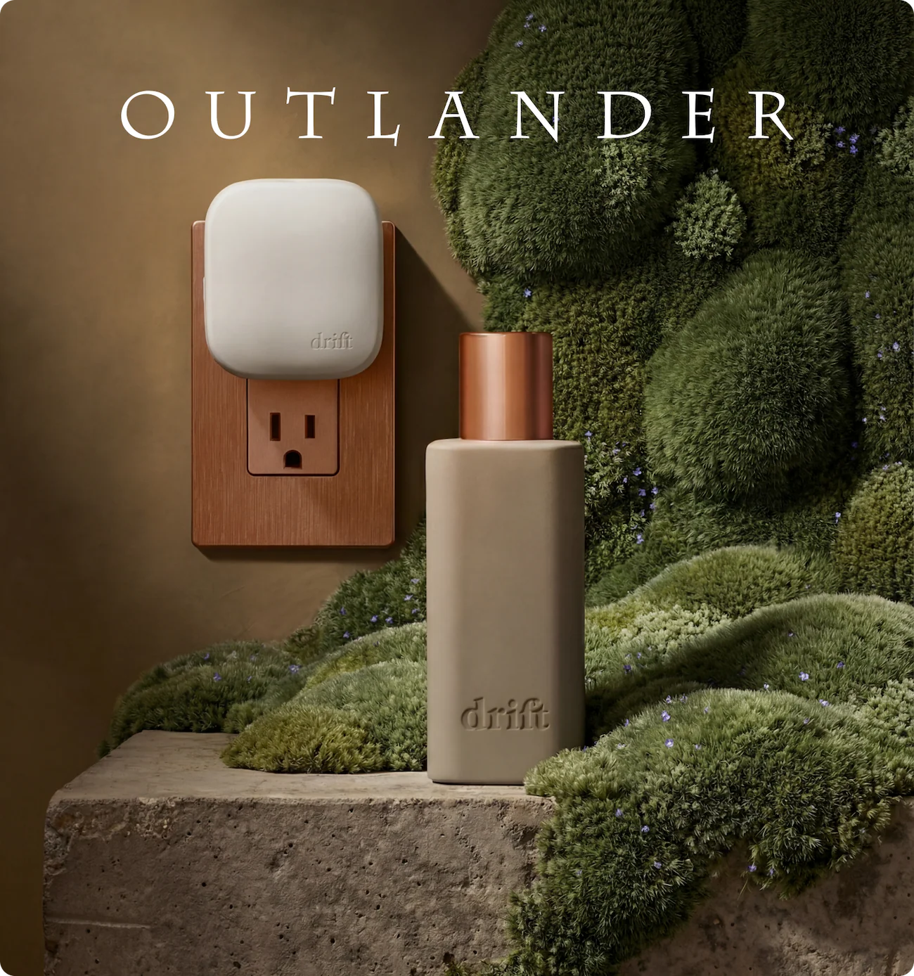 Drift plug-in scent diffuser and fragrance bottle displayed on a moss-covered surface inspired by the Scottish Highlands, promoting the Outlander-themed home fragrance collection.