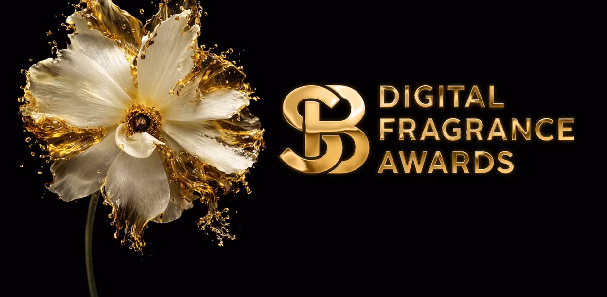 Close-up of a white flower with gold liquid splashing around its petals next to the Digital Fragrance Awards logo on a black background.